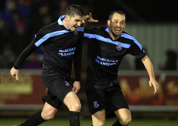 Davy Munster celebrates with team-mate Tony Kane after scoring the winning goal against Ballinamallard in the semi-final of the Wasp Solutions League Cup. Picture: Press Eye.