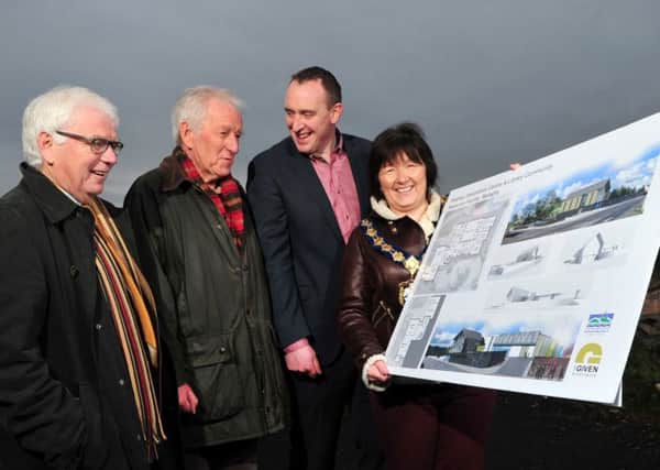 Checking out the architects impression of the new Heaney Interpretive Centre during Tuesday afternoon's official sod cutting in Bellaghy were Sam and Hugh Heaney with Cathal Mallaghan Chairperson of the Mid-Ulster Council and Kate McEldowney Chairperson of Magherafelt District Council.INMM5114-434
