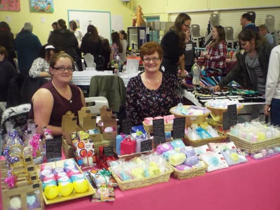 Carrickfergus College teacher Miss Hanna and her mother on duty at a stall. INCT 52-707-CON
