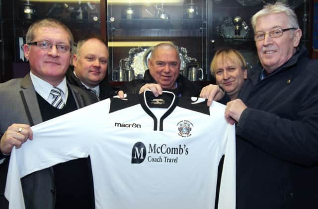 Lisburn Distillery's official sponsor - McComb's Coach Travel - in addition to recent match sponsorship have now re-badged the first eleven home and away strips. Manager Tommy Kincaid, assistant manager Andy Harwood, Rodney McComb (McComb's Coach Travel), Director Colin Hopkins and Chairman Jim Greer (right) display the finished article. Picture - David Hunter.