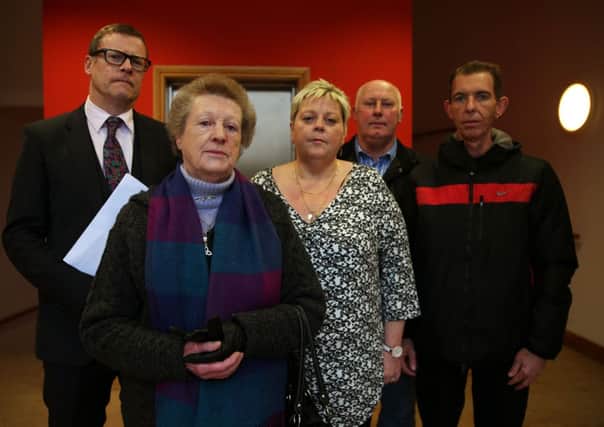 Margaret Campbell, whose husband was shot dead by loyalists in 1973, with her daughter Donna Patrick-Campbell, son-in-law Patrick Barry, son Patrick Campbell (right) and solicitor Kevin Winters (left) in Belfast. PRESS ASSOCIATION Photo. Picture date: Tuesday December 16, 2014.  Margaret is to sue the chief constable of the PSNI and Ministry of Defence. The family claim the police and army colluded to protect the UVF killer. See PA story ULSTER Campbell. Photo credit should read: Brian Lawless/PA Wire