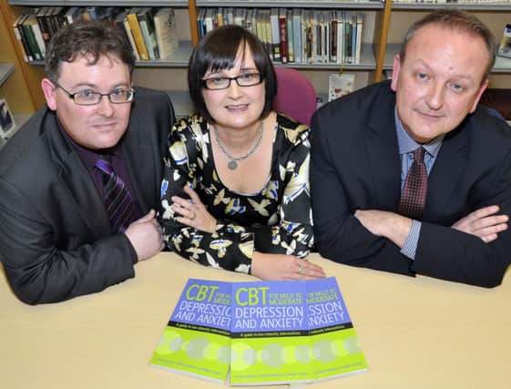 At the launch of their new book in Lisburn Library on depression and anxiety are the authors Colin Hughes, Joanne Younge, and Stephen Herron US5014-401PM Pic by Paul Murphy