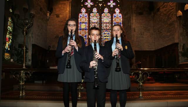 Downshire School clarinet players Nicola Johnston, David Lyle and Amy Barnes performing at the carol service in St Nicholas' Parish Church. INCT 52-791-CON