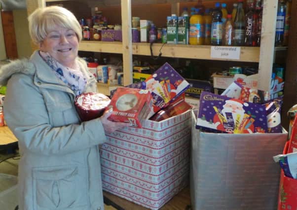 Mina McKinney, Newtownabbey Foodbank co-ordinator, with some of the hampers destined for needy families.