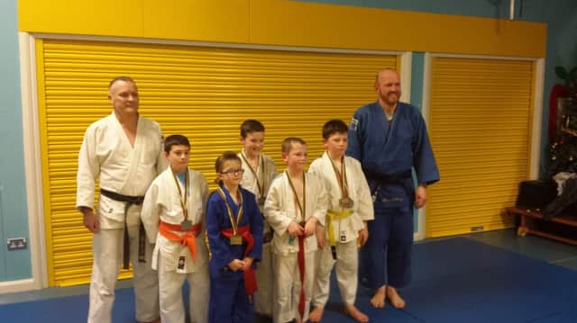 Pictures are of the coaches Alan Ashcroft and Marshall Craig with the senior and junior competitors. INBM51-14S