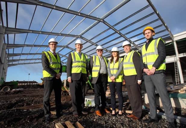 Gordon Davidson, Ulster Bank; Edwin Poots MLA; Joe Tumelty, developer; Oonagh Potter, Ulster Bank; Cllr Paul Porter; and Sean McManus, Lough Construction, on the site of the new 18-lane 10-pin bowling centre. US1452-502cd  Picture: Cliff Donaldson