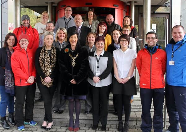 The Mayor Councillor Brenda Stevenson with Derry City Council staff who successfully took part in a council initiative Couch to 5K and a 12 weeks to Christmas pounds away programme. 5014-23968MT.