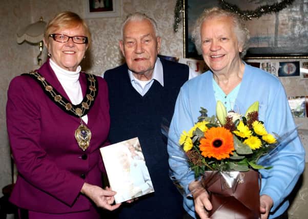 Mayor of Ballymena, Cllr. Audrey Wales, is pictured with Albert and Audrey Price who recently celebrated their 60th Wedding Anniversary. The couple, who were married in Ulsterville Presbyterian Church in Belfast by the Rev. McKeown, have three sons, one daughter, eight grandchildren and seven great grandchildren. INBT53-238AC