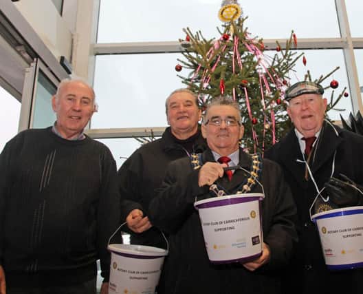 Sam Crowe (left), president of Carrickfergus Rotary Club, has thanked shoppers for supporting this year's Tree of Hope.