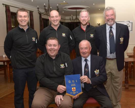 Banbridges Senior Cup team present the Ulster pennant to Captain Noel McSherry and President John Parks.