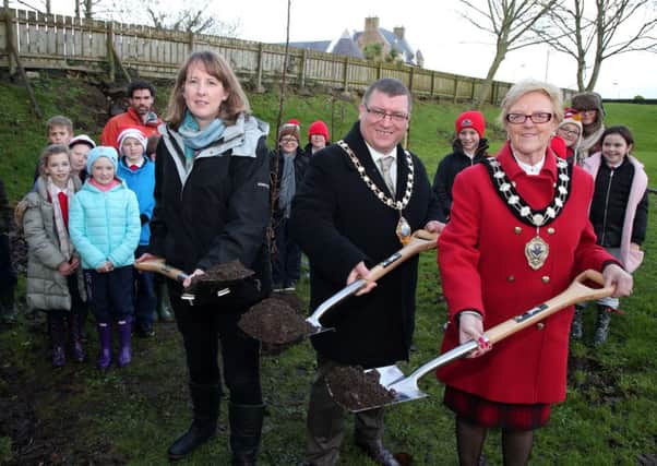 Helen Thompson (NIEA), Councillor Martin Wilson (Mayor of Larne), Councillor Audrey Wales (Mayor of Ballymena) and school children from Cairncastle PS at the launch of the Mid and East Antrim Local Biodiversity Action Plan at Ballygally Hall. INLT 53-678-CON