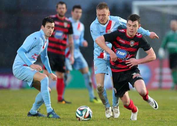 Ballymena's Stephen McBride with Coleraine's Shane McGinty during today's 'derby' at the Showgrounds. Picture: Press Eye.