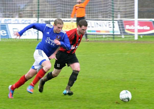 A sprint for the ball during the O'Kane Cup final.