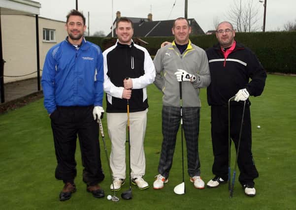 Steven Bell, Philip McAllister, Cliff Andrews and William Andrews about to tee off at Ballymena Golf Club. INBT49-243AC