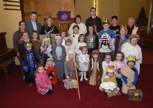 Children and leaders who staged a Christmas Nativity play in St. Peterâ¬"s Church. included are Archdeacon Robert Miller and Reverend Katie McAteer. INLS5214-101KM