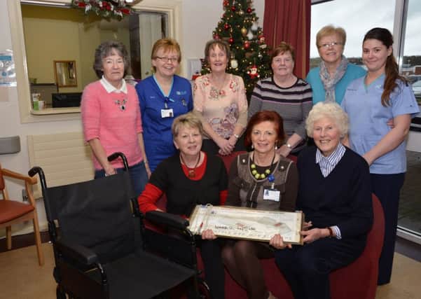 Pictured at the presentation of equipment by the Friends of the Waterside Hospital were, from left, seated, Edna Wray, Treasurer, Judy Houlahan, Head of Service and Lead Nurse, and Margaret Sherman, Chairperson, standing, Sally Brolly, Sister Doreen Marshall, Lilly McGeady, Helen Moore, Irene Robb, Vice-Chairperson, and Staff Nurse Ashley Oâ¬"Neill. INLS5114-123KM