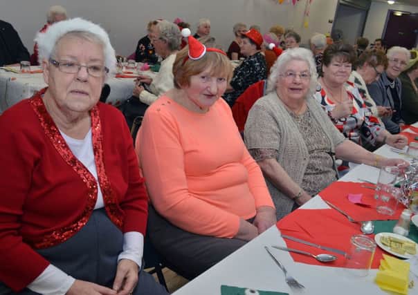Making an effort to dress up for the Ballee Senior Citzens Club annual Christmas dinner and party in Ballee Community Hall last week. INBT 52-814H