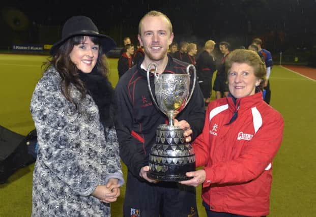 Banbridge captain Eugene Magee with Marianne McCall of GOC Estate Agents and UHU President Ann Rosa. Pic: Rowland White / Presseye.