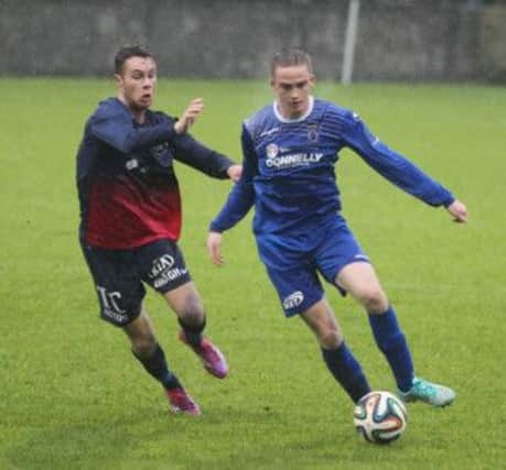 Andrew Burns skips away from his marker during a MOTM display for Dungannon at Stangmore Park.