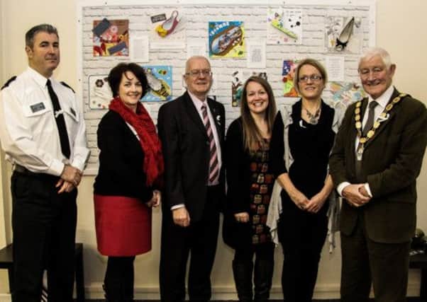 Inspector Jim Gourley, Newtownabbey PSNI; Pam Cameron MLA; Councillor Victor Robinson; Grace McGurk, community resettlement worker for Women's Aid; Ase McWilliams, floating support worker for Women's Aid; and Deputy Mayor Pat McCudden, pictured at Women's Aid's White Ribbon art project unveiling. INNT 51-505-SO