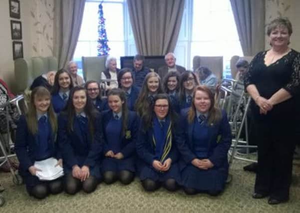 Members of the Loreto College Senior Choir, and Music teacher Mrs Annie Sharkey, who provided an afternoon of seasonal entertainment at the Seabank Residential Home, Portrush.