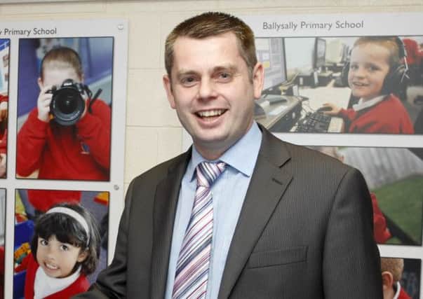 Shane McCurdy, NEELB chief executive, who visited Ballysally Primary School last Friday is pictured with Geoff Dunn, principal. CR21-229PL