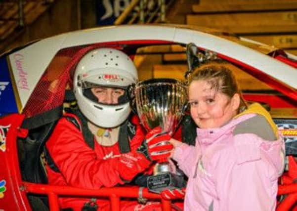 Sarah Gilmore presents the Gilmore Engineering Winter National Trophy to National Hot Rod winner Jaimie McCurdy, from Broughshane.