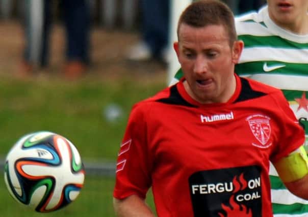 Larne skipper Paul Maguire scored twice from the penalty spot against Dundela