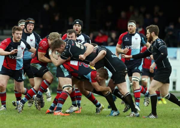 Ballymena's Connor Smyth drives at the Belfast Harlequins defence. Pictures: Press Eye.
