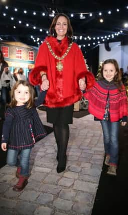 Belfast Lord Mayor Nichola Mallon with little Isabella and Matilda Hendron at Titanic Belfastâ¬"s Magical Christmas Experience. Families such as the Hendrons that are in receipt of support from Cancer Fund for Children got a sneak peek of the festive event on Friday night.