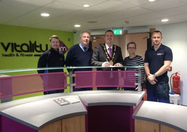 The Mayor of Lisburn, Councillor Andrew Ewing is pictured in the new Vitality Gym at Lagan Valley LeisurePlex as he becomes a member of this new facility. Also present are staff of the 'Vitality Health and Fitness' facility.