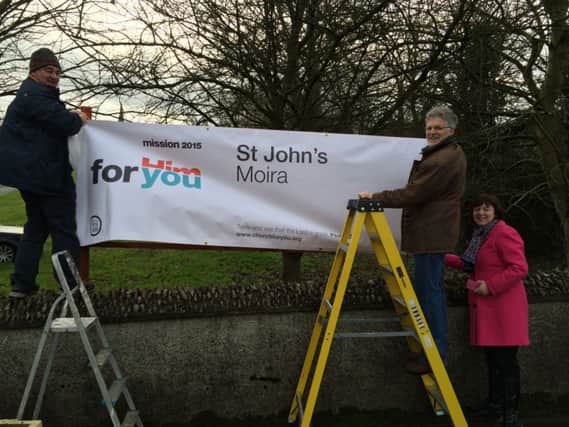 St John's Parish, Moira put their welcoming banner up for the 2015 Year of Mission. Left to right:  David Kerr, Ken Little and Rev Joanne Megarrell