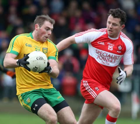 Donegal's Dermot Molloy and Derry's Barry McGoldrick.

 Photo Lorcan Doherty/Presseye.com