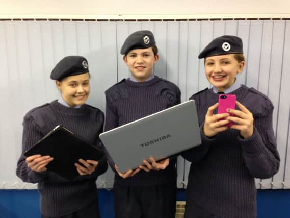 2062 (Carrickfergus) Squadron has set up social media profiles to keep people up-to-date with its latest news. Pictured (from left) are:
 Chloe Wright, David Glass and Emma Griffith. INCT 01-750-CON