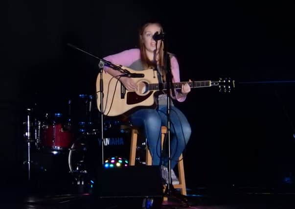 Olivia Peden of year 9 performing 'The One That Got Away' at Carrickfergus Grammar School's 'Pop Act'. INCT 03-701-CON