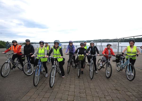 Group from the Derry Well Woman pictured on a cycle across Derry's Peace Bridge for Bike Week. (2106SL29)