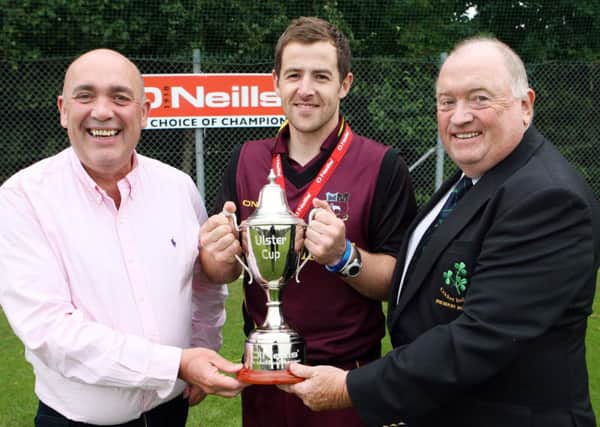 Bready Captain David Scanlon receiving the O'Neill's Ulster Cup from Kieran Kennedy, managing director, O'Neill's Sportswear, and Joe Doherty, president, Cricket Ireland. Picture by Lorcan Doherty/Presseye.com