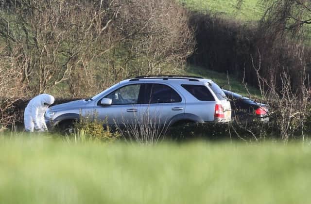 Forsenic officers at the scene of the Randalstown murder where they are examining a number of cars involved in the incident.  Picture: Steven McAuley/McAuley Multimedia