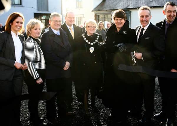 Minister of Enterprise, Trade and Investment, Arlene Foster, cuts a ribbon to officially open Raceview Mill, along with the Mayor of Ballymena, Cllr. Audrey Wales, Roy McKeown and invited guests. INBT03-209AC