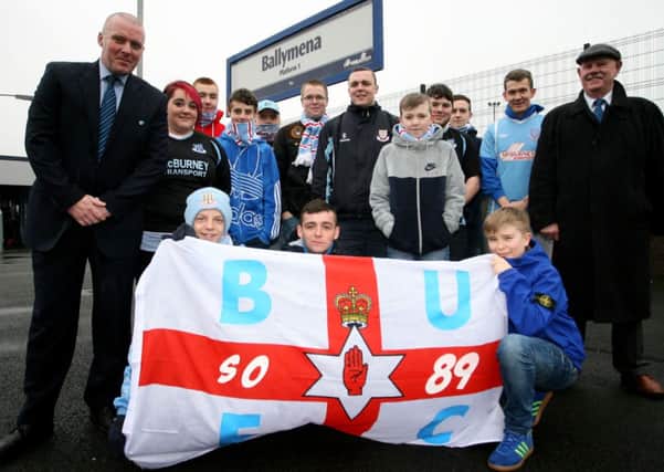 Andrew McQuillen and Frank Moore (Line Manager) of Translink, with Ballymena United fans promoting the special train for fans traveling to the League Cup final on January 24. INBT03-215AC