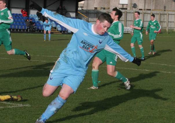 Make mine a double Portstewart striker Johnny Stewart celebrates his second goal against Dundela inThe Irish Cup on Saturday.PICTURE MARK JAMIESON.