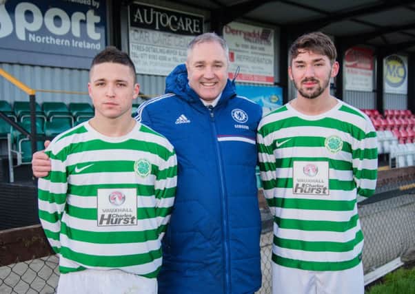Lurgan Celtic manager Colin Malone with new signings Adam Rodgers and Josh Barton.