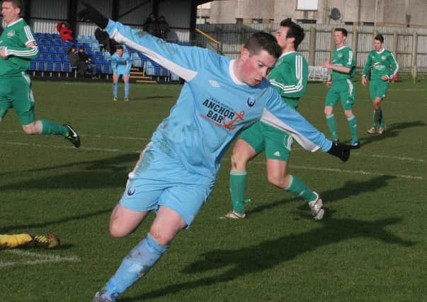 Make mine a double Portstewart striker Johnny Stewart celebrates his second goal against Dundela inThe Irish Cup on Saturday.PICTURE MARK JAMIESON.