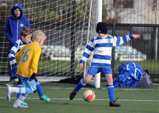 Northend U-11 clear the danger during Saturday's NIBFA Cup tie against Ballymoney. INBT 03-932H