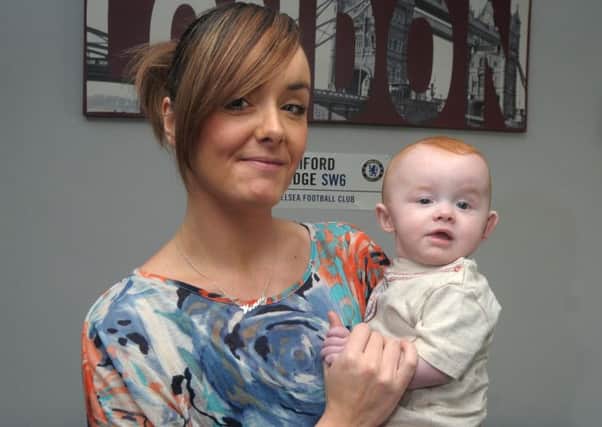 Wyatt Magee, who is six months old and suffers from Plagiocephaly is pictured with his Mum, Kerry INLT 03-201-AM
