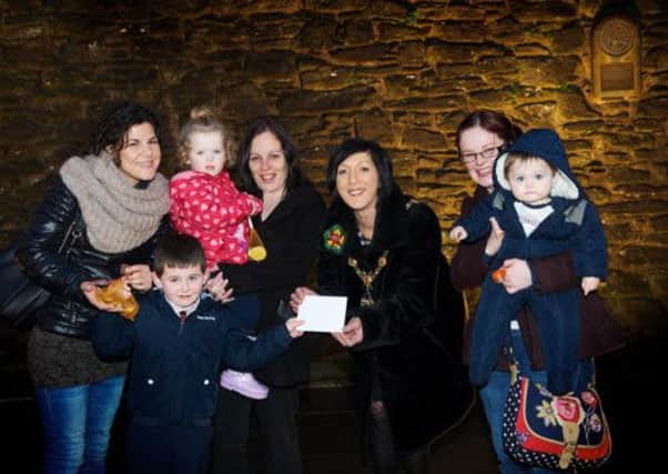 The Mayor, Brenda Stevenson, presenting the prize to the winners of the 2014 Derry Walls Day Treasure Hunt. Incuded are Ms Enrica DAlessandro, Friends of the Derry Walls, Olivia, Jenna and Ben McShane plus Natalie and Caolan Palmer. Photocredit :Stephen Latimer Photography.