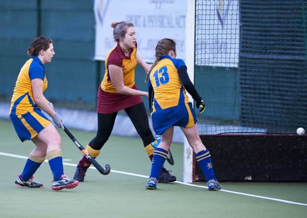 Mossley's Tori Wallace (centre) finds the net in Saturday's 4-1 win over Bangor at The Glade. INLT 03-912-CON