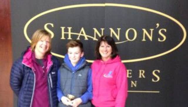 Jack and Joanne Livingstone who were winners in the Alpha Family Fun Tournamen Sponsored by Shannon's The Jewellers with Jenny Stephenson (Alpha Executive Member).