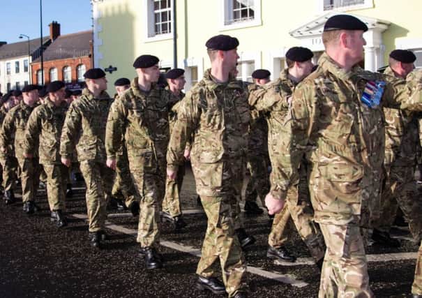 Members of the Armed Forces parade past the Town Hall in Carrick   INCT 46-464-RM