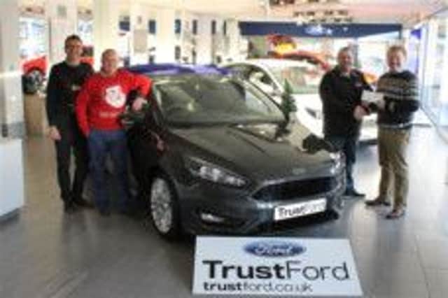 Trust Ford Sales teampictured with Roy Dixon, Branch Manager, presents Phillip Kelly, Provincial Players Chairman, with sponsorship for their production of 'Cinderella'.  They are pictured at the launch of the new Ford Focus.